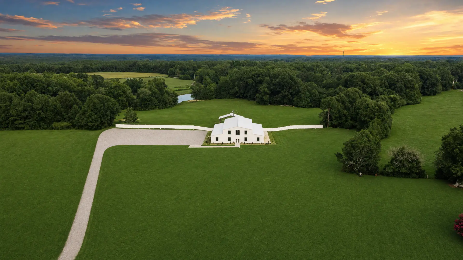 Wide aerial view of the farm at sunset