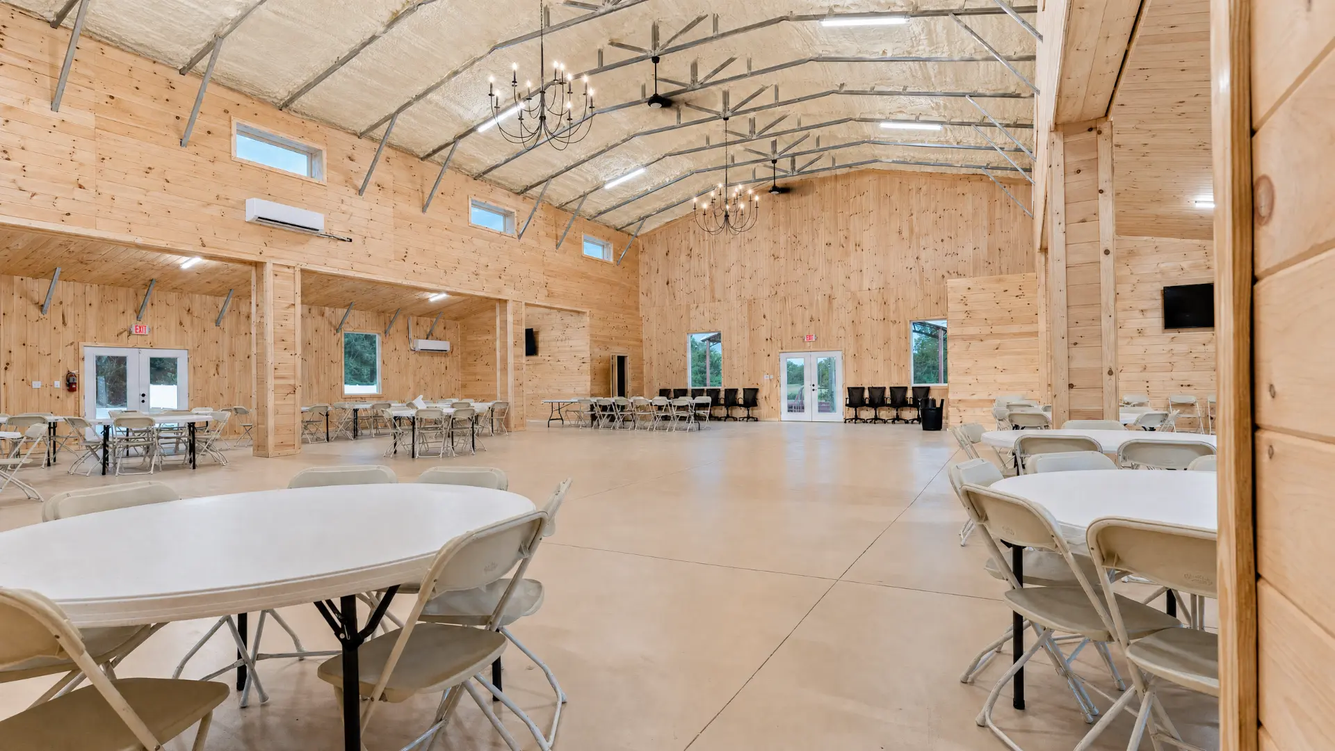 Event hall arranged with round banquet tables