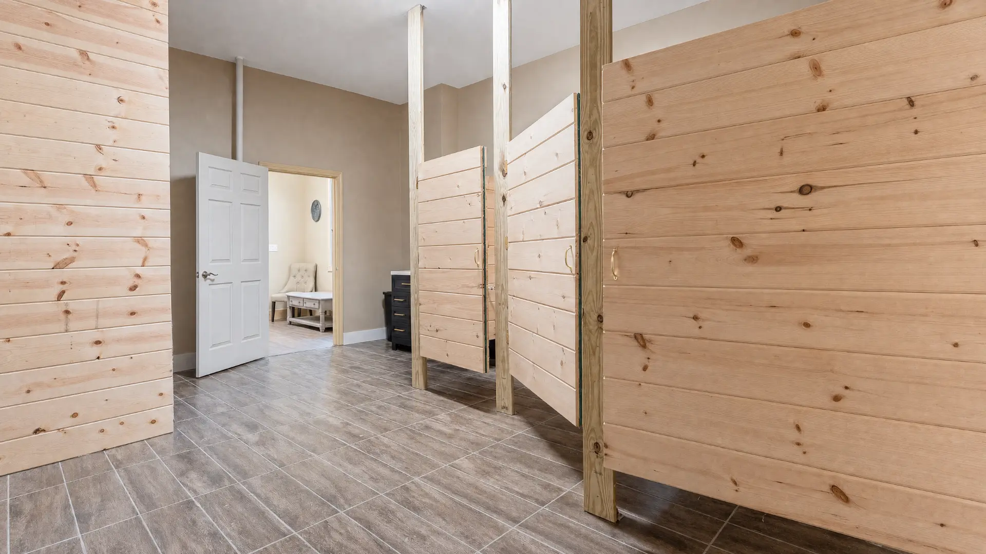 Entry hall with pine partitions leading to the suite