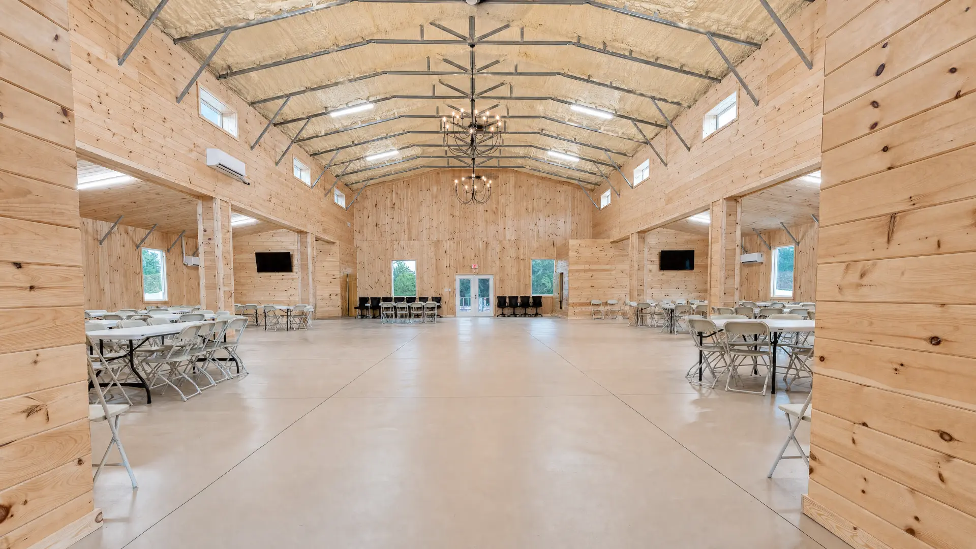 Long view of the event hall toward the entry doors