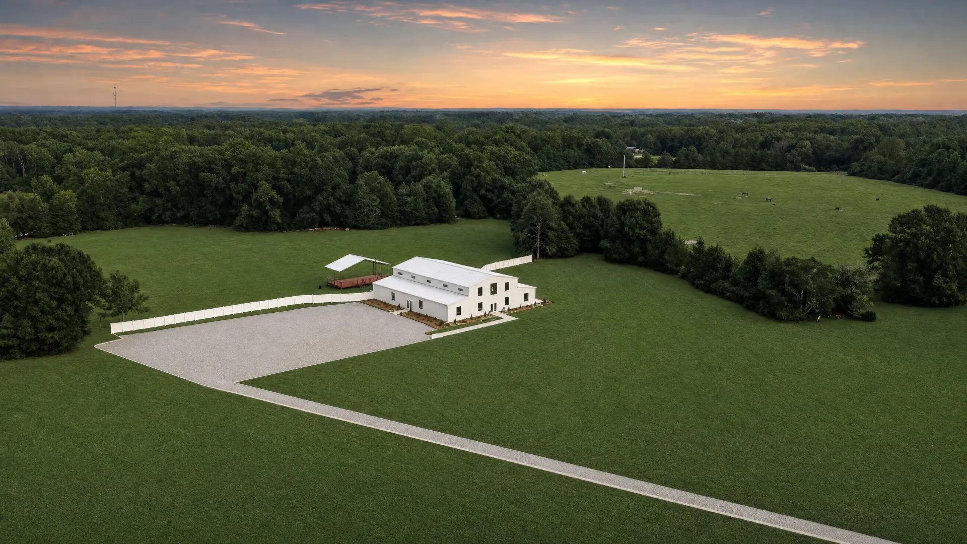Aerial view of the barn beside open pasture